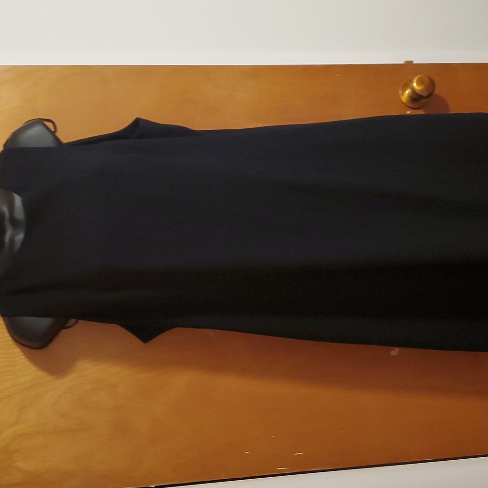 Sleeveless black sheath dress
